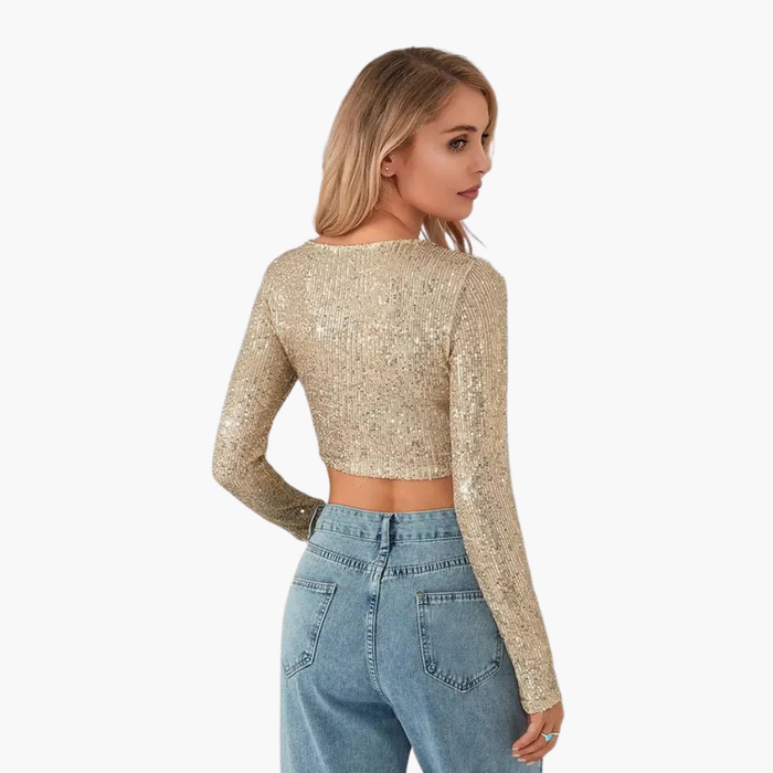 Top da donna a maniche lunghe con scollo rotondo e superficie esterna con paillettes