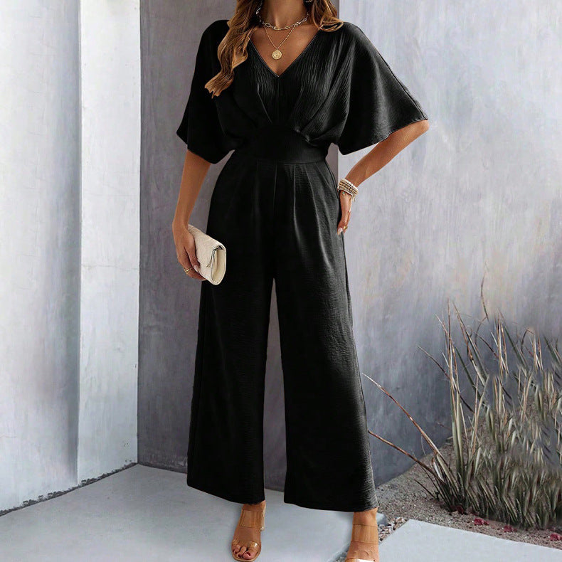 Dame Vid Jumpsuit med V-Hals og Elegant Drapering