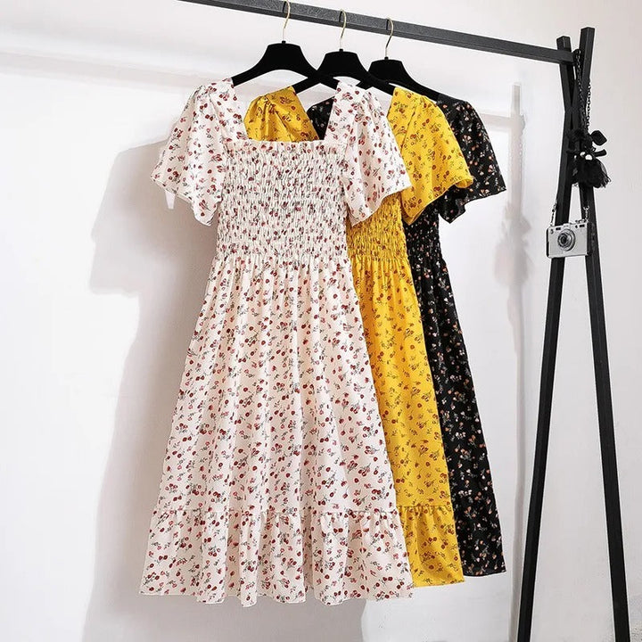 Kvinnenes Elegante Blomstrete Midikjole – Perfekt for Sommeren